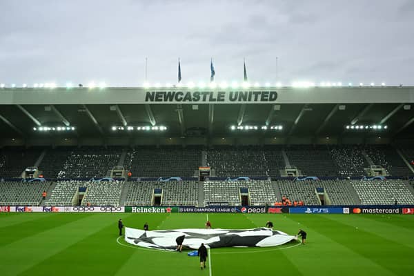 A general view inside the stadium as a UEFA Champions League logo is seen on the pitch prior to the UEFA Champions League match between Newcastle United FC and Paris Saint-Germain at St. James Park on October 04, 2023 in Newcastle upon Tyne, England. (Photo by Michael Regan/Getty Images)