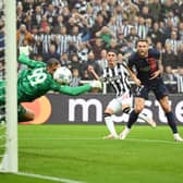 Miguel Almiron of Newcastle United scores the team’s first goal during the UEFA Champions League match between Newcastle United FC and Paris Saint-Germain at St. James Park on October 04, 2023 in Newcastle upon Tyne, England.