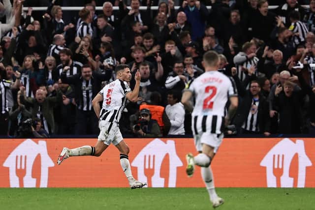 Newcastle United’s Swiss defender #05 Fabian Schar (L) celebrates scoring the team’s fourth goal during the UEFA Champions League Group F football match between Newcastle United and Paris Saint-Germain at St James’ Park in Newcastle-upon-Tyne, north east England on October 4, 2023. (Photo by FRANCK FIFE/AFP via Getty Images)
