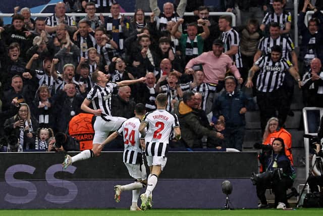  Sean Longstaff celebrates scoring the team's third goal during the UEFA Champions League Group F football match between Newcastle United and Paris Saint-Germain at St James' Park in Newcastle-upon-Tyne, north east England on October 4, 2023. (Photo by FRANCK FIFE / AFP) (Photo by FRANCK FIFE/AFP via Getty Images)