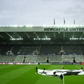 : A general view inside the stadium as a UEFA Champions League logo is seen on the pitch prior to the UEFA Champions League match between Newcastle United FC and Paris Saint-Germain at St. James Park on October 04, 2023 in Newcastle upon Tyne, England. (Photo by Michael Regan/Getty Images)