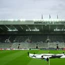 : A general view inside the stadium as a UEFA Champions League logo is seen on the pitch prior to the UEFA Champions League match between Newcastle United FC and Paris Saint-Germain at St. James Park on October 04, 2023 in Newcastle upon Tyne, England. (Photo by Michael Regan/Getty Images)