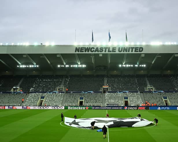 : A general view inside the stadium as a UEFA Champions League logo is seen on the pitch prior to the UEFA Champions League match between Newcastle United FC and Paris Saint-Germain at St. James Park on October 04, 2023 in Newcastle upon Tyne, England. (Photo by Michael Regan/Getty Images)