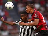 Malick Thiaw gets the better of Alexander Isak in an aerial battle.