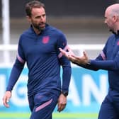 JUNE 12: Gareth Southgate (L), Head Coach of England speaks with Dr Ian Mitchell, Performance psychologist of England during the England Training Session ahead of the Euro 2020 Group D match between England and Croatia at St. George's Park on June 12, 2021 in Burton upon Trent, England. (Photo by Laurence Griffiths/Getty Images)