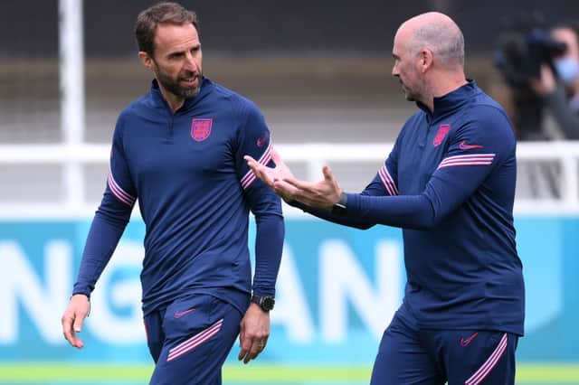 JUNE 12: Gareth Southgate (L), Head Coach of England speaks with Dr Ian Mitchell, Performance psychologist of England during the England Training Session ahead of the Euro 2020 Group D match between England and Croatia at St. George's Park on June 12, 2021 in Burton upon Trent, England. (Photo by Laurence Griffiths/Getty Images)