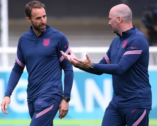 JUNE 12: Gareth Southgate (L), Head Coach of England speaks with Dr Ian Mitchell, Performance psychologist of England during the England Training Session ahead of the Euro 2020 Group D match between England and Croatia at St. George's Park on June 12, 2021 in Burton upon Trent, England. (Photo by Laurence Griffiths/Getty Images)
