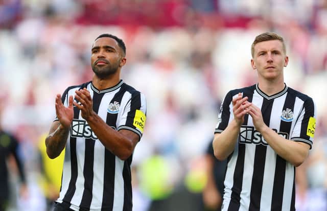 Callum Wilson and Matt Targett of Newcastle United applaud fans following the Premier League match between West Ham United and Newcastle United at London Stadium on October 08, 2023 in London, England. (Photo by Tom Dulat/Getty Images)