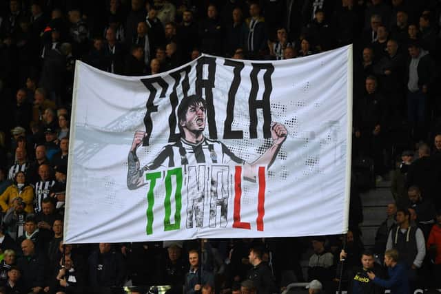 Newcastle fans display a banner in support of Newcastle United's Italian midfielder #08 Sandro Tonali ahead of the English Premier League football match between Newcastle United and Crystal Palace at St James' Park in Newcastle-upon-Tyne, north east England on October 21, 2023. (Photo by ANDY BUCHANAN / AFP