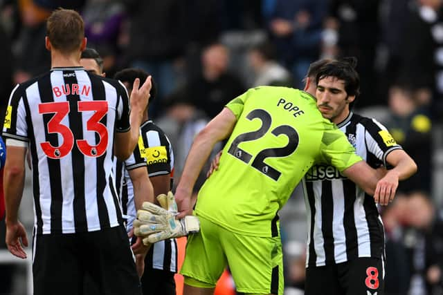 Nick Pope of Newcastle United embraces Sandro Tonali after the Premier League match between Newcastle United and Crystal Palace at St. James Park on October 21, 2023 in Newcastle upon Tyne, England. (Photo by Stu Forster/Getty Images)