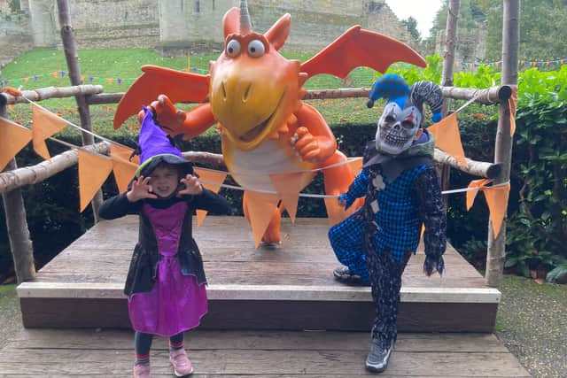 Eddie and Rosanna Morton by a statue of Zog at Warwick Castle