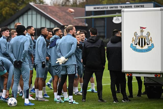 Newcastle United's English striker #09 Callum Wilson (C) reacts with teammates as they attend a training session at the team's training facility in Newcastle-upon-Tyne, northeast England, on October 24, 2023 on the eve of their UEFA Champions League group F football match against Borussia Dortmund. (Photo by Oli SCARFF / AFP) (Photo by OLI SCARFF/AFP via Getty Images)