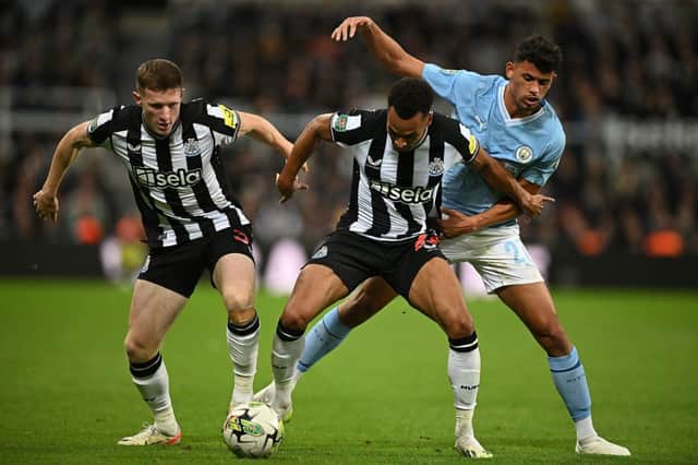 Newcastle United duo Elliot Anderson & Jacob Murphy. (Photo by OLI SCARFF/AFP via Getty Images)