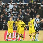 Felix Nmecha of Borussia Dortmund celebrates with teammates after scoring the team's first goal during the UEFA Champions League match between Newcastle United FC and Borussia Dortmund at St. James Park on October 25, 2023 in Newcastle upon Tyne, England. (Photo by Michael Regan/Getty Images)