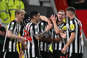Newcastle United players celebrate their remarkable 3-0 win at Old Trafford. 