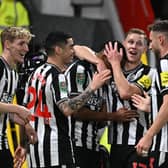 Newcastle United players celebrate their remarkable 3-0 win at Old Trafford. 