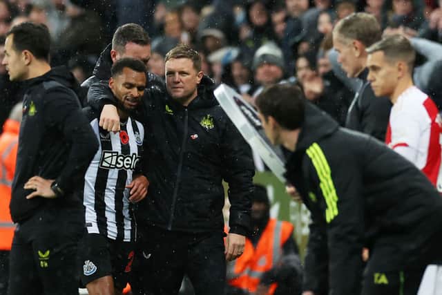 Jacob Murphy of Newcastle United interacts with Eddie Howe, Manager of Newcastle United, after being substituted off during the Premier League match between Newcastle United and Arsenal FC at St. James Park on November 04, 2023 in Newcastle upon Tyne, England. 