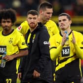 Marco Reus, Karim Adeyemi, Salih Ozcan and Marcel Sabitzer of Borussia Dortmund look dejected at full-time after their team's defeat in the Bundesliga match between Borussia Dortmund and Bayern Munich at Signal Iduna Park. (Photo by Lars Baron/Getty Images)