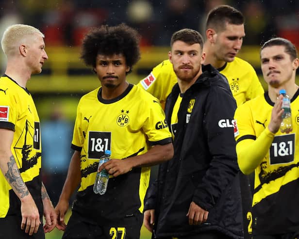 Marco Reus, Karim Adeyemi, Salih Ozcan and Marcel Sabitzer of Borussia Dortmund look dejected at full-time after their team's defeat in the Bundesliga match between Borussia Dortmund and Bayern Munich at Signal Iduna Park. (Photo by Lars Baron/Getty Images)