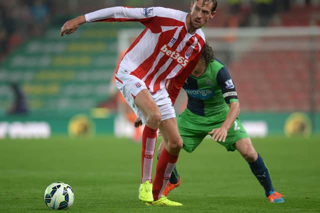 Peter Crouch had a famous coming together with Fabricio Coloccini (Image: Getty Images)