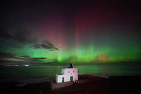 The aurora borealis, also known as the northern lights, appears over Bamburgh Lighthouse. Northumberland is one of the best places in the UK to see the Northern lights becuase of its clear skies. 