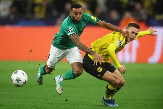 Callum Wilson of Newcastle United battles for possession with Nico Schlotterbeck of Borussia Dortmund during the UEFA Champions League match between Borussia Dortmund and Newcastle United at Signal Iduna Park on November 07, 2023 in Dortmund, Germany. (Photo by Alex Grimm/Getty Images)