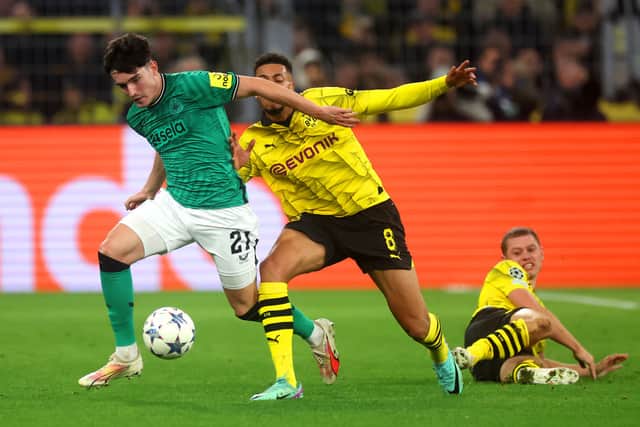 Tino Livramento of Newcastle United is challenged by Felix Nmecha of Borussia Dortmund during the UEFA Champions League match between Borussia Dortmund and Newcastle United at Signal Iduna Park on November 07, 2023 in Dortmund, Germany.