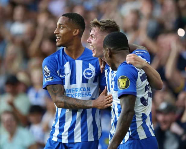 Evan Ferguson of Brighton & Hove Albion celebrates with Pervis Estupinan and Joao Pedro after scoring the team's second goal during the Premier League match between Brighton & Hove Albion and Newcastle United. (Photo by Steve Bardens/Getty Images)