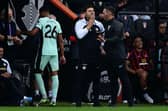 Chelsea manager Mauricio Pochettino with defender Levi Colwill pictured in the background. (Photo by BEN STANSALL/AFP via Getty Images)