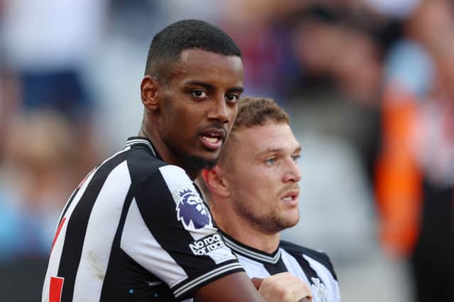 Alexander Isak of Newcastle United celebrates with team mate Kieran Trippier after scoring their sides first goal during the Premier League match