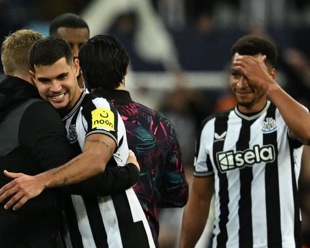 Newcastle United midfielder Bruno Guimaraes with Eddie Howe after win over Paris Saint-Germain. (Photo by PAUL ELLIS/AFP via Getty Images)