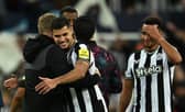 Newcastle United midfielder Bruno Guimaraes with Eddie Howe after win over Paris Saint-Germain. (Photo by PAUL ELLIS/AFP via Getty Images)