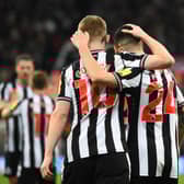 Newcastle United Anthony Gordon celebrates scoring the team's fourth goal with Miguel Almiron against Chelsea. (Photo by ANDY BUCHANAN / AFP) 