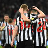 Newcastle United Anthony Gordon celebrates scoring the team's fourth goal with Miguel Almiron against Chelsea. (Photo by ANDY BUCHANAN / AFP) 