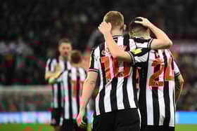Newcastle United Anthony Gordon celebrates scoring the team's fourth goal with Miguel Almiron against Chelsea. (Photo by ANDY BUCHANAN / AFP) 
