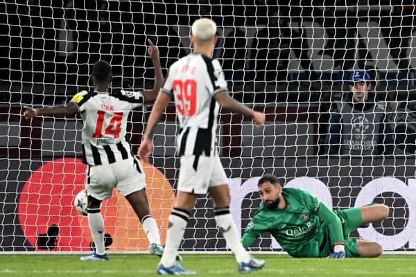Newcastle United's Swedish striker #14 Alexander Isak scores a goal against Paris Saint-Germain's Italian goalkeeper #99 Gianluigi Donnarumma during the UEFA Champions League 1st round, day 5, Group F football match between Paris Saint-Germain (PSG) and Newcastle United at the Parc des Princes stadium in Paris, on November 28, 2023. 