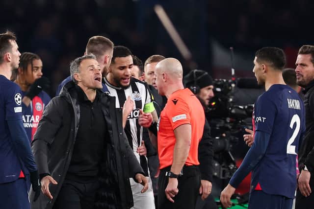 Szymon Marciniak is confronted by Jamaal Lascelles and Luis Enrique at the final whistle.
