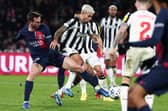 Paris Saint-Germain midfiekder Fabian Ruiz and  Newcastle United midfielder Bruno Guimaraes. (Photo by FRANCK FIFE/AFP via Getty Images)