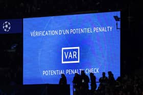 A giant screen indicates a potential penalty check during the UEFA Champions League 1st round, day 5, Group F football match between Paris Saint-Germain (PSG) and Newcastle United.(Photo by FRANCK FIFE / AFP) 