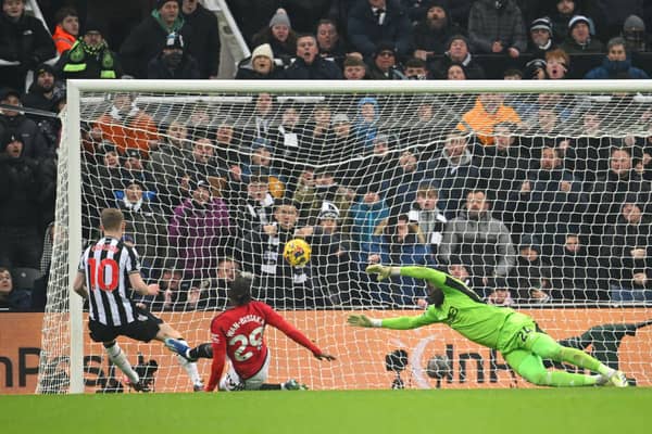 Anthony Gordon of Newcastle United scores the team's first goal during the Premier League match between Newcastle United and Manchester United at St. James Park on December 02, 2023 in Newcastle upon Tyne, England.