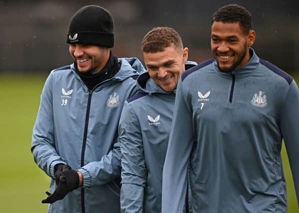 Newcastle United's Brazilian midfielder #39 Bruno Guimaraes (L), Newcastle United's English defender #02 Kieran Trippier (C) and Newcastle United's Brazilian striker #07 Joelinton attend a training session at the team's training facility in Newcastle-upon-Tyne, northeast England, on October 24, 2023 on the eve of their UEFA Champions League group F football match against Borussia Dortmund. (Photo by Oli SCARFF / AFP) (Photo by OLI SCARFF/AFP via Getty Images)