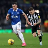 Jack Harrison of Everton runs with the ball whilst under pressure from Kieran Trippier of Newcastle United during the Premier League match between Everton FC and Newcastle United at Goodison Park on December 07, 2023 in Liverpool, England. 