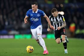 Jack Harrison of Everton runs with the ball whilst under pressure from Kieran Trippier of Newcastle United during the Premier League match between Everton FC and Newcastle United at Goodison Park on December 07, 2023 in Liverpool, England. 