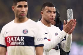 Paris Saint-Germain's French forward #07 Kylian Mbappe (R) reacts at the end of the UEFA Champions League group F football match with Borussia Dortmund. (Photo by FRANCK FIFE/AFP via Getty Images)