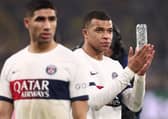 Paris Saint-Germain's French forward #07 Kylian Mbappe (R) reacts at the end of the UEFA Champions League group F football match with Borussia Dortmund. (Photo by FRANCK FIFE/AFP via Getty Images)