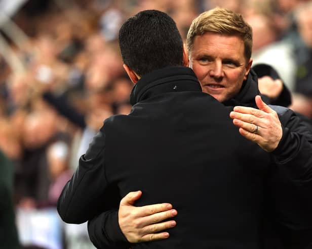 Eddie Howe, Manager of Newcastle United, embraces Mikel Arteta, Manager of Arsenal, prior to the Premier League match on November 4. (Photo by Ian MacNicol/Getty Images)