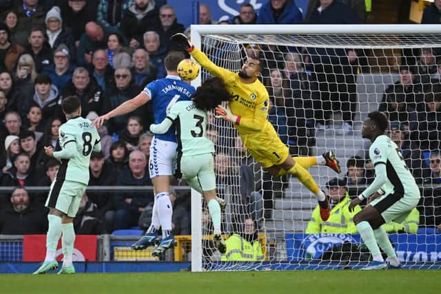 Robert Sanchez and Marc Cucurella of Chelsea jump for the ball with James Tarkowski of Everton during the Premier League match between Everton FC and Chelsea FC. (Photo by Stu Forster/Getty Images)