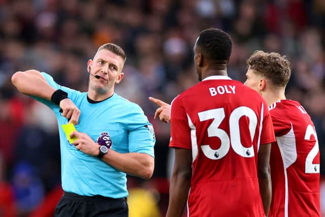 Referee Robert Jones shows a second yellow card to Willy Boly of Nottingham Forest, resulting in a red card, during the Premier League match between Nottingham Forest and AFC Bournemouth. (Photo by Marc Atkins/Getty Images)