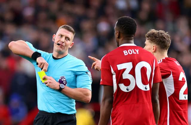 Referee Robert Jones shows a second yellow card to Willy Boly of Nottingham Forest, resulting in a red card, during the Premier League match between Nottingham Forest and AFC Bournemouth. (Photo by Marc Atkins/Getty Images)