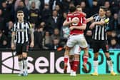 Chris Wood of Nottingham Forest celebrates with team mate Morgan Gibbs-White after scoring their sides third goal during the Premier League match between Newcastle United and Nottingham Forest at St. James Park on December 26, 2023 in Newcastle upon Tyne, England. 